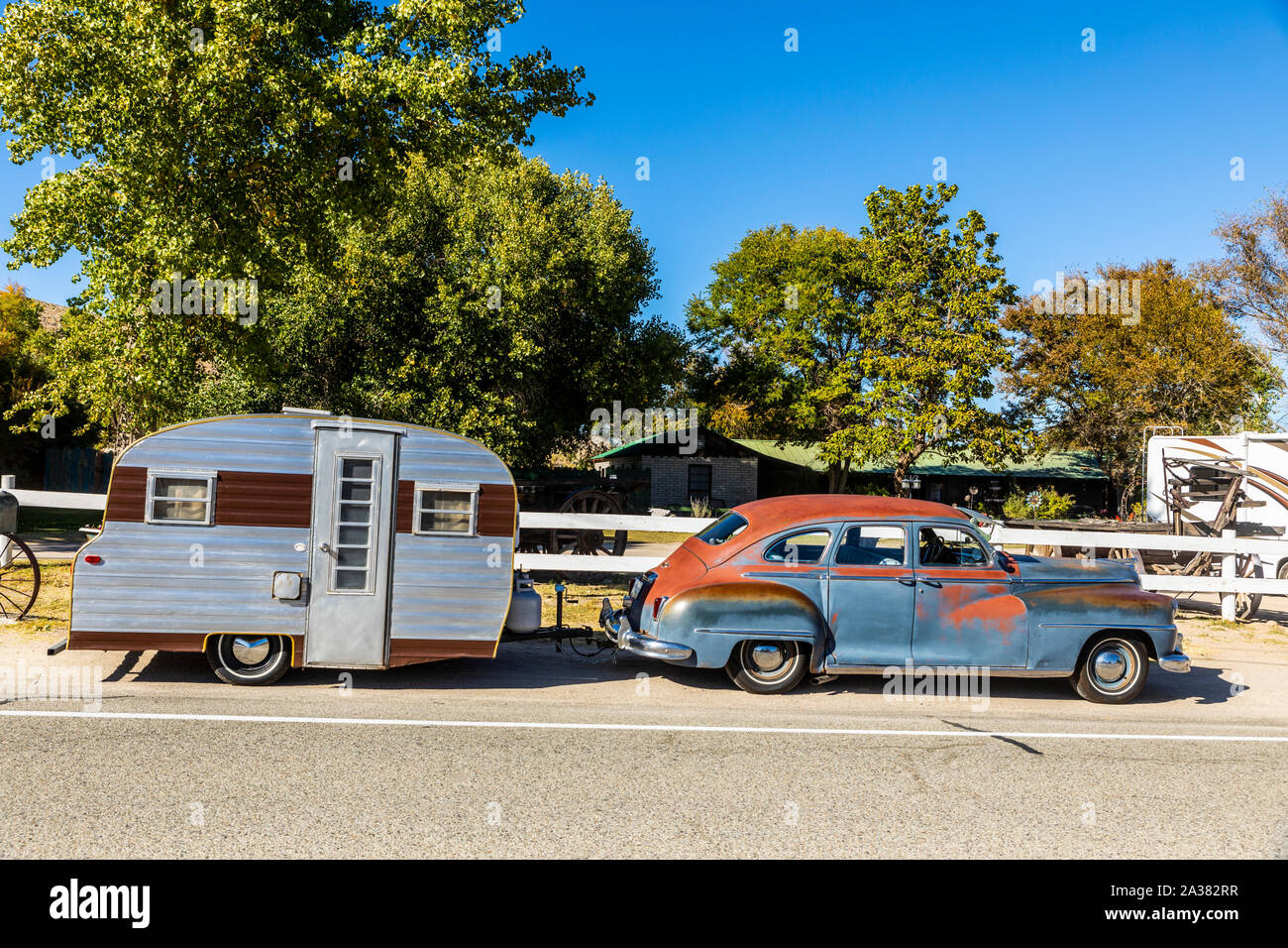A 1946 DeSoto car and a vintage travel trailer in Benton Hot Springs in remote eastern California Stock Photo