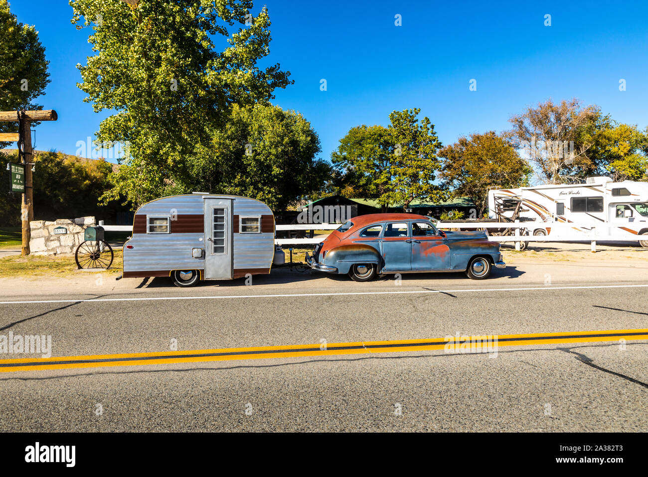 A 1946 DeSoto car and a vintage travel trailer in Benton Hot Springs in remote eastern California Stock Photo