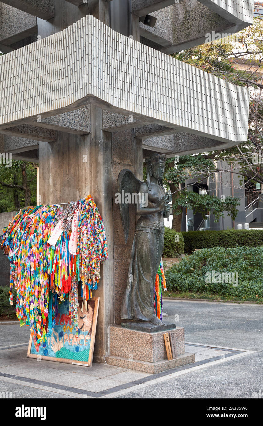 HIROSHIMA, JAPAN – NOVEMBER 23, 2007: Goddess of Peace and the garlands of  folded paper cranes at the base of Memorial Tower to the Mobilized Student Stock Photo