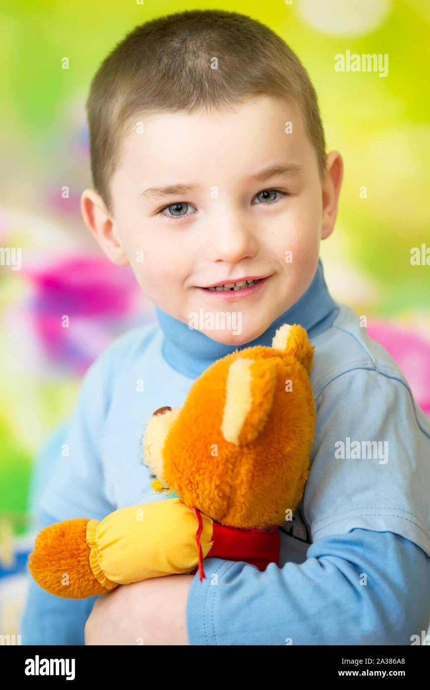 Portrait of a four year old boy with a teddy bear Stock Photo - Alamy