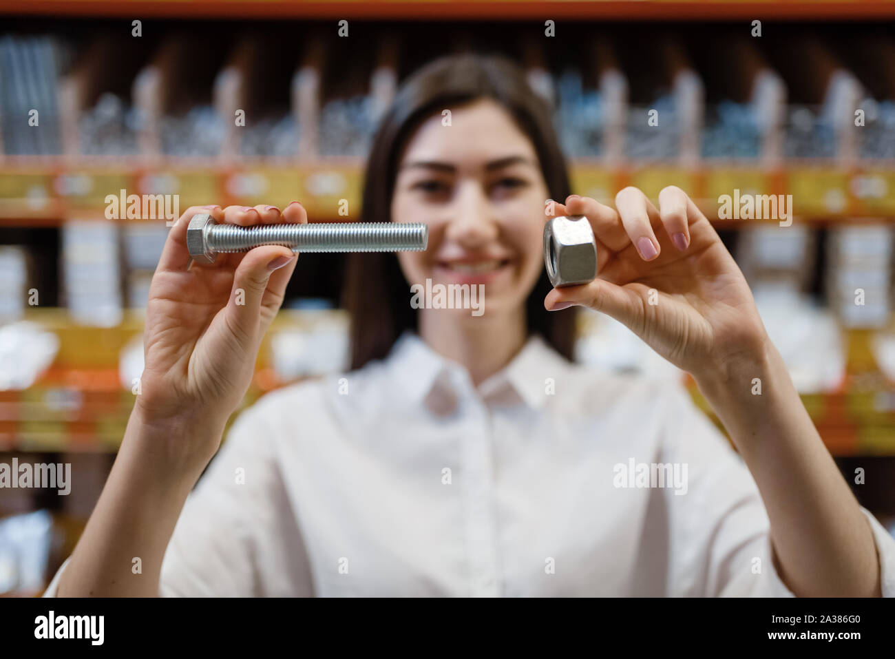 Customer choosing nuts and bolts in hardware store Stock Photo Alamy