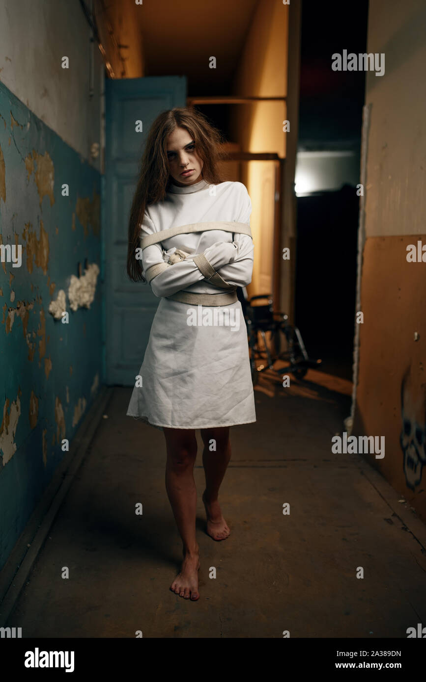 Female patient in straitjacket, mental hospital Stock Photo