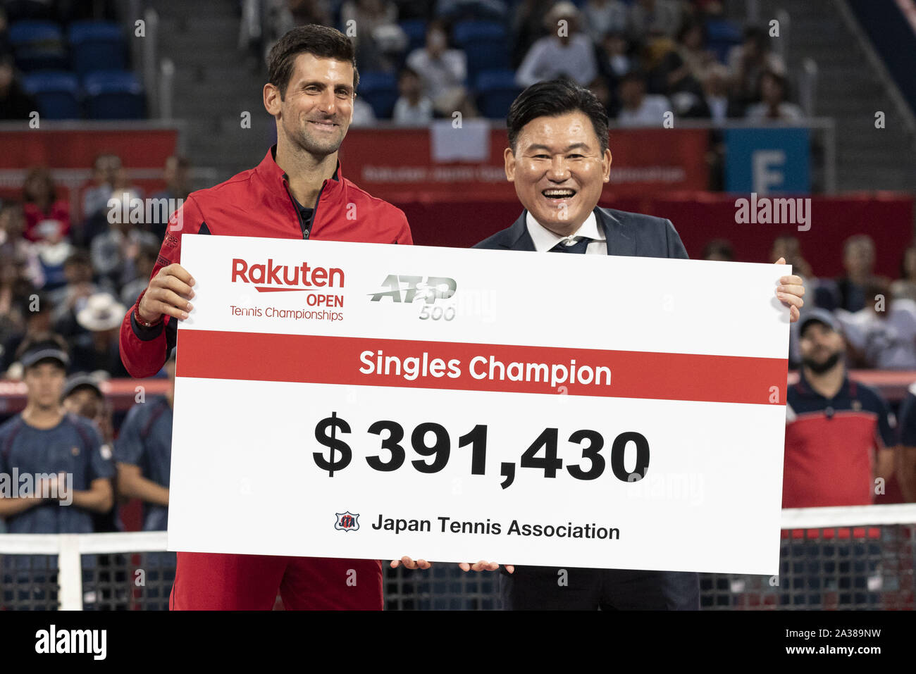 Tokyo, Japan. 6th Oct, 2019. Novak Djokovic receives prize money from  Hiroshi Mikitani chairman and CEO of Rakuten after winning the men's  singles final match of the Rakuten Japan Open Tennis Championships