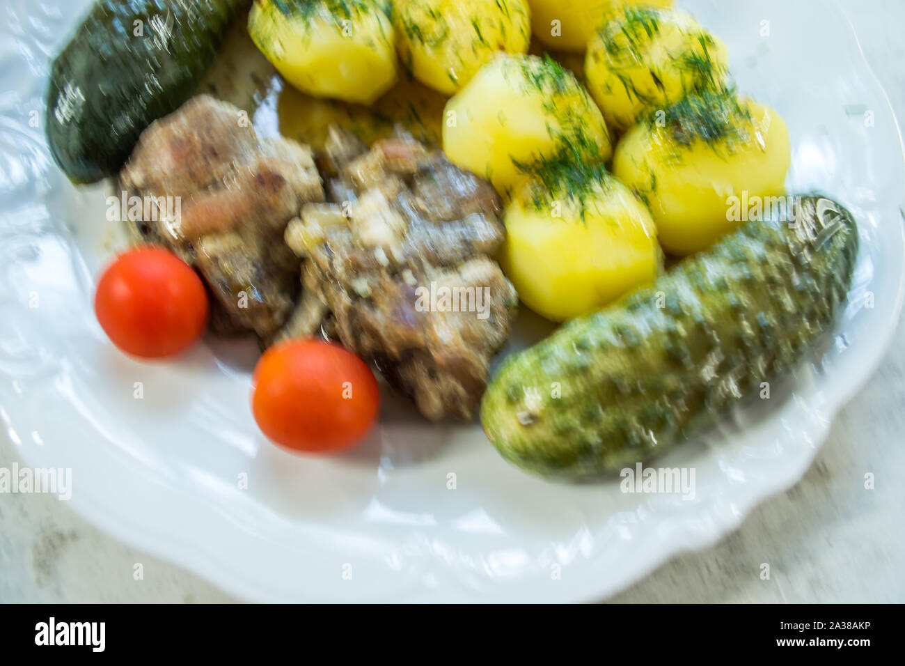 Custom-made lunch with meat and potatoes. Stock Photo