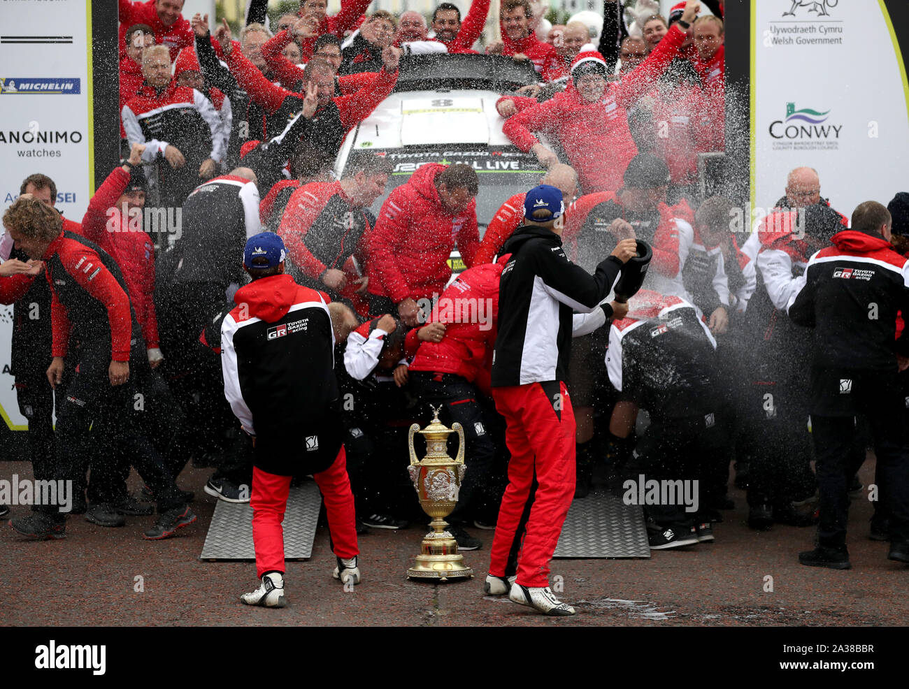Winners of the Wales Rally GB Estonia’s Ott Tanak and Martin Jarveoja celebrate with champagne during day four of the Wales Rally GB. Stock Photo