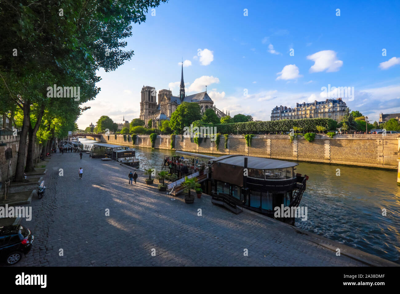 People walking along the riverbank of River Seine, Paris, France Stock Photo