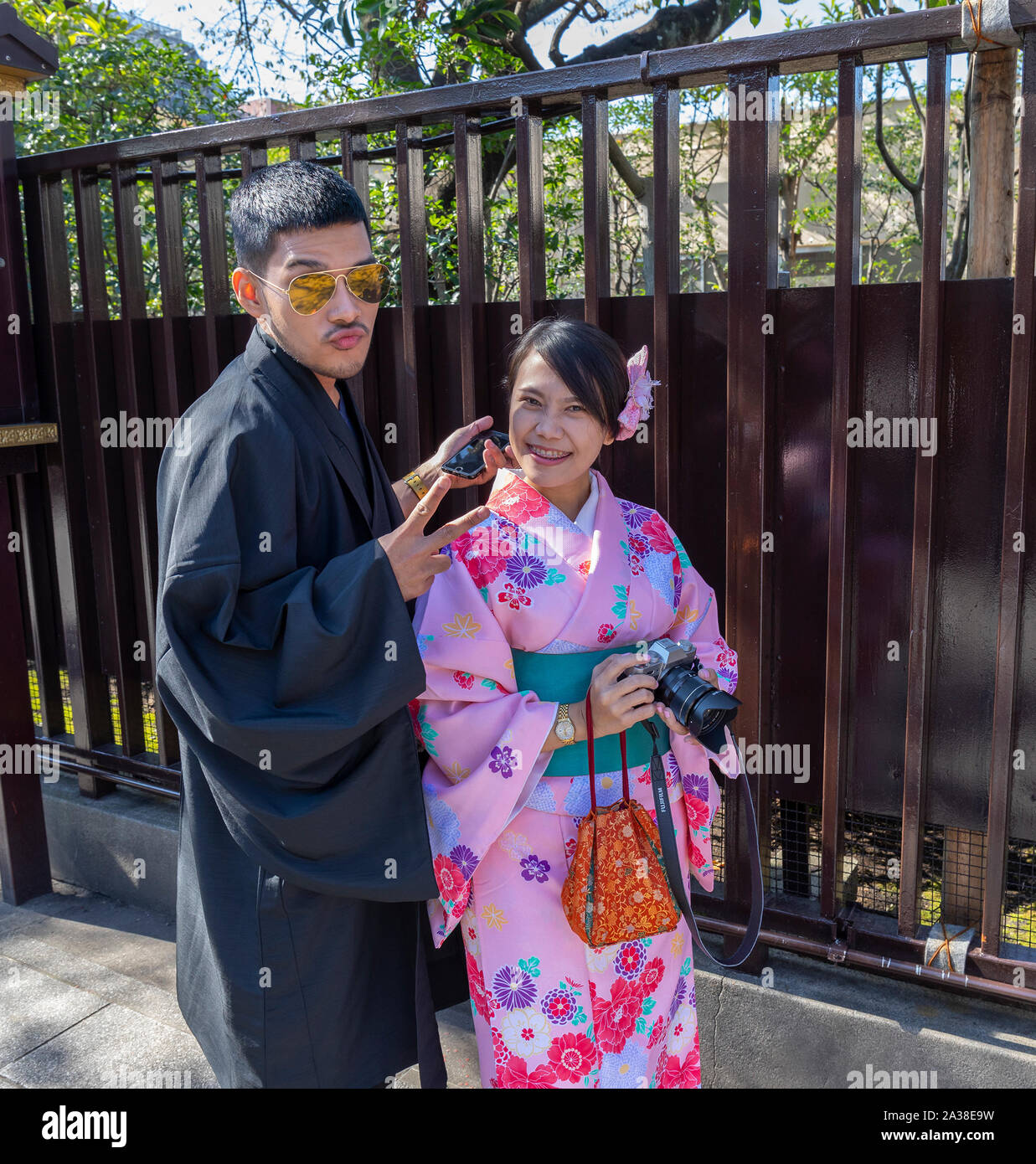Tokyo, Japan - october 30th, 2018: A young couple in traditional clothes on their way to the Senso - Ji temple in Tokyo, Japan Stock Photo