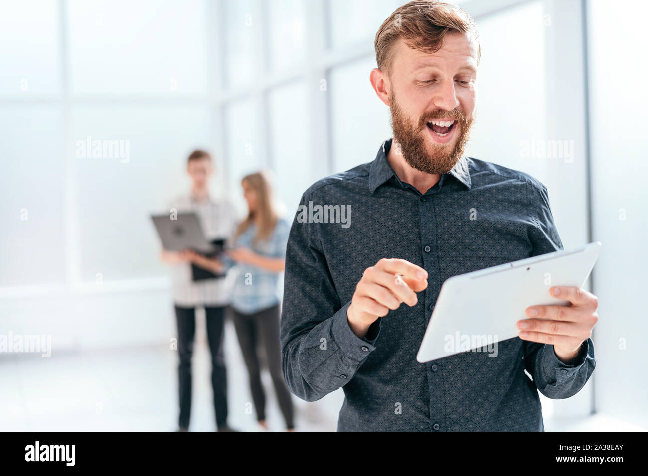 happy businessman looking at the screen of his digital tablet Stock ...