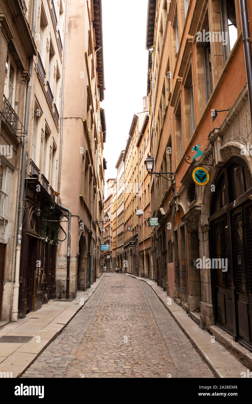 Beautiful old buildings house shops and restaurants on the Rue des Trois-Maries in the Vieux Lyon quarter of Lyon, France. Stock Photo