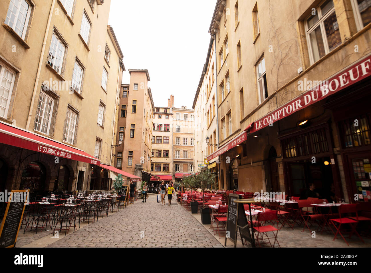 French restaurants line the Place Neuve Saint-Jean in the old quarter of Lyon, France. Stock Photo