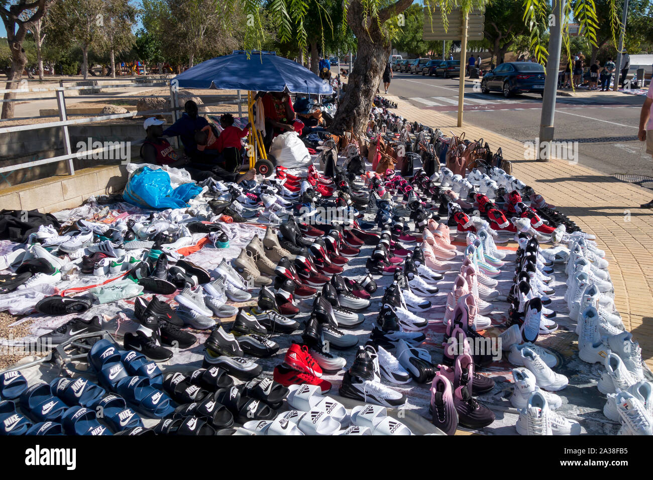 L'Hospitalet, Spain - September 08, 2019: Illegal market of fake sport  shoes, counterfeit in the street called top manta Stock Photo - Alamy