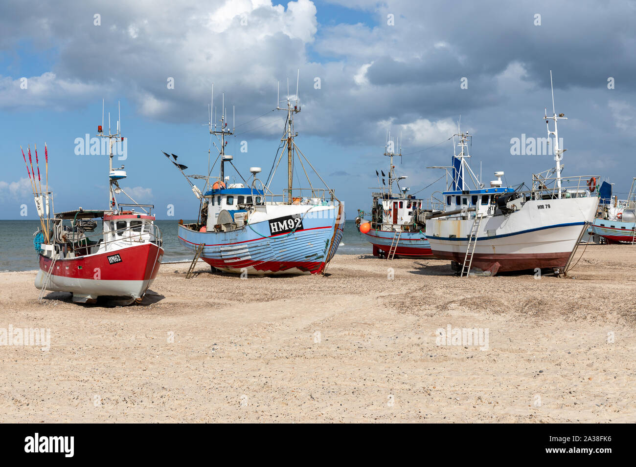 Fishing boats drawn up on the beach at Thorup Strand, Denmark Stock Photo