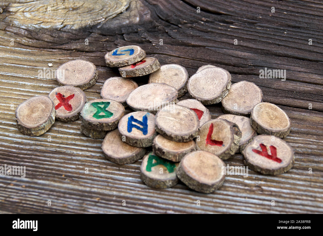 Set of carved oak branch runes, known as the germanic futhark, on ...