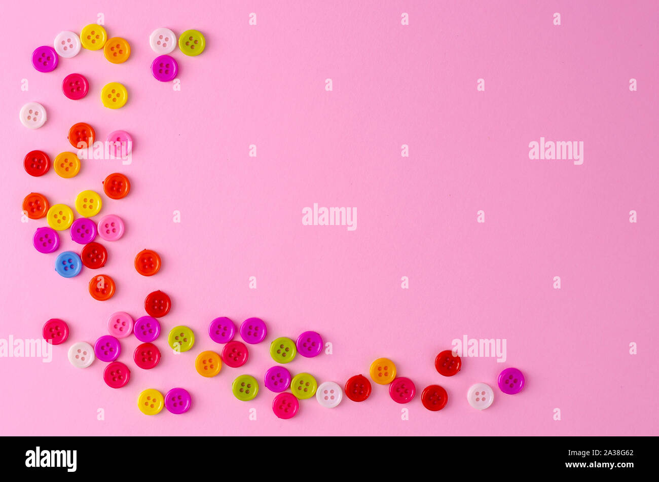 Many colorful buttons on blue background. Selective focus. Copy space Stock Photo