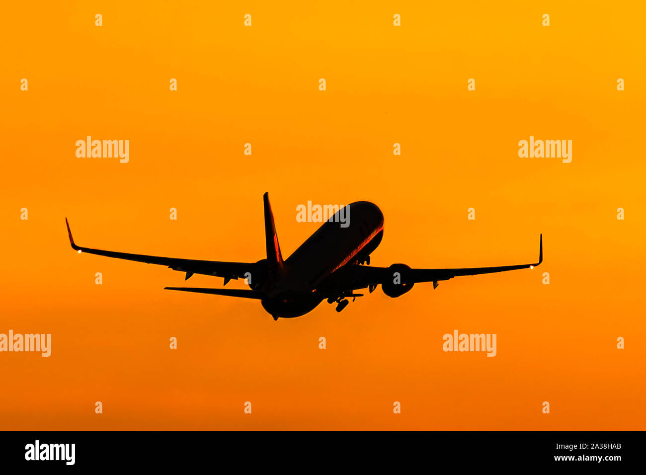 Aircraft taking off at sunset Stock Photo - Alamy