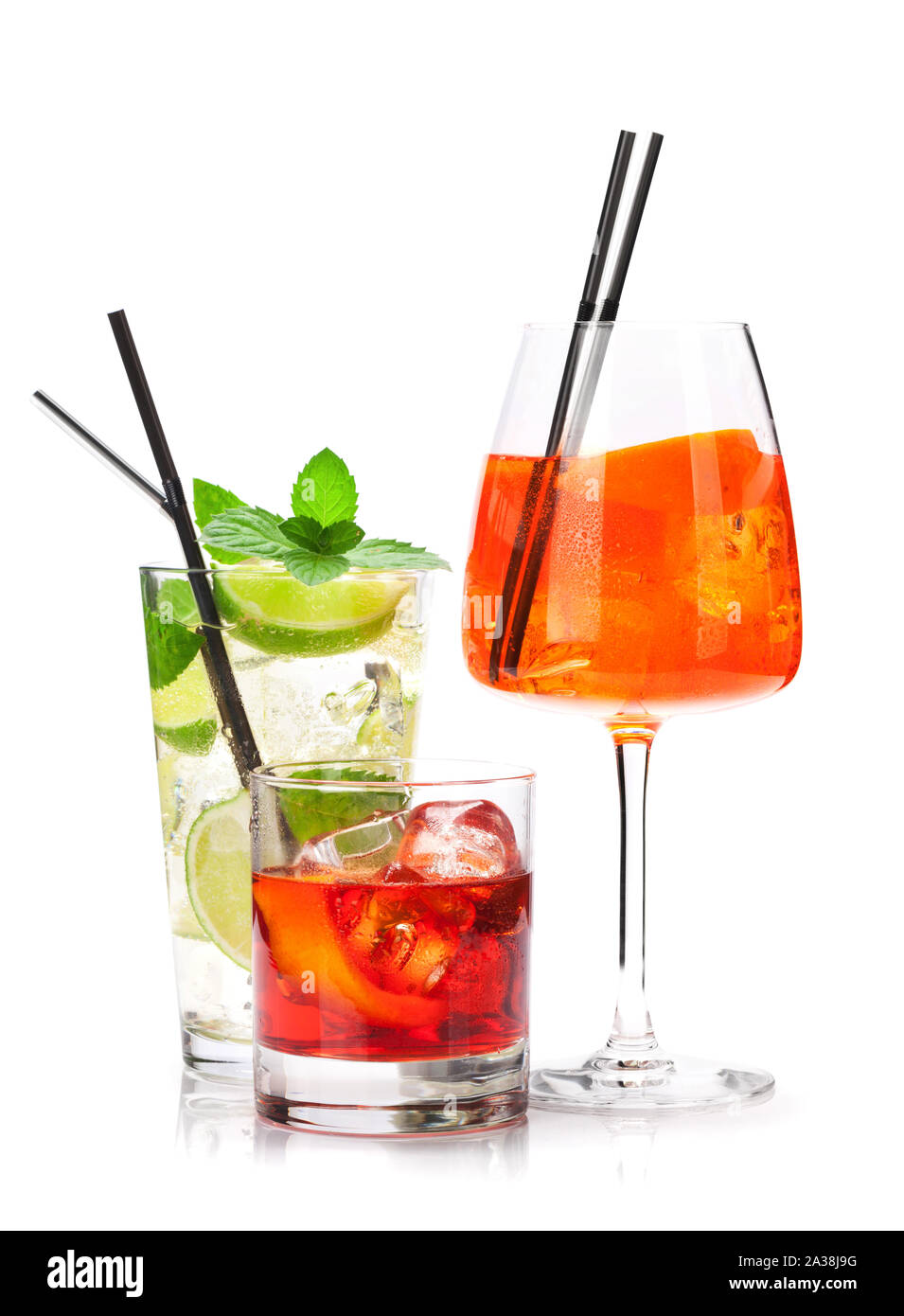 Three classic cocktail glasses. Negroni, aperol spritz and mojito