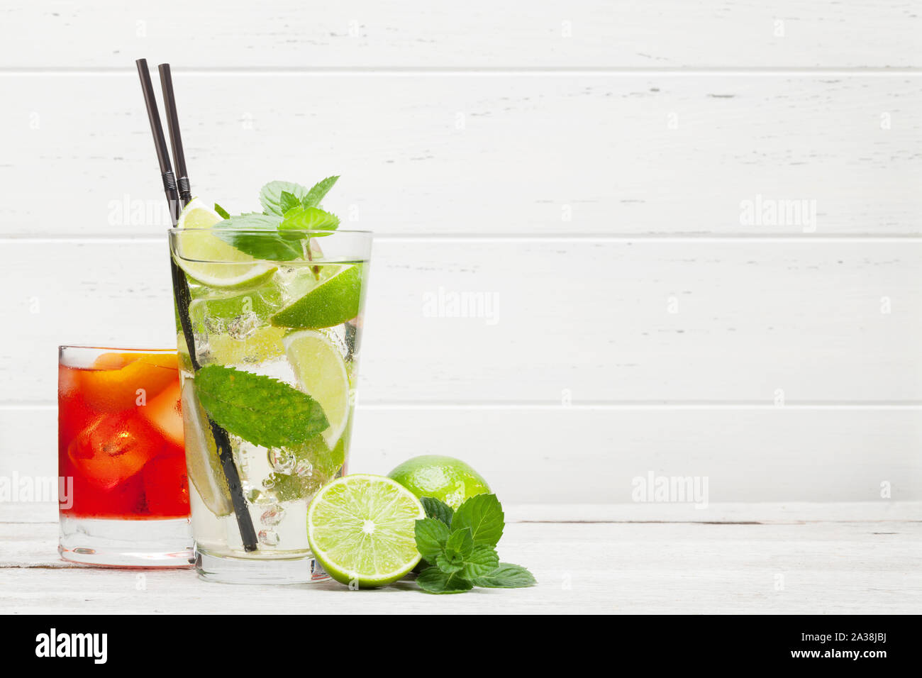 Two Classic Cocktail Glasses On Wooden Table Negroni And Mojito With Copy Space Stock Photo Alamy