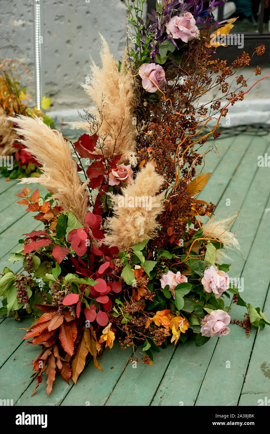 Composition of pampas grass, palm trees and roses.Decorative floristry  Stock Photo - Alamy