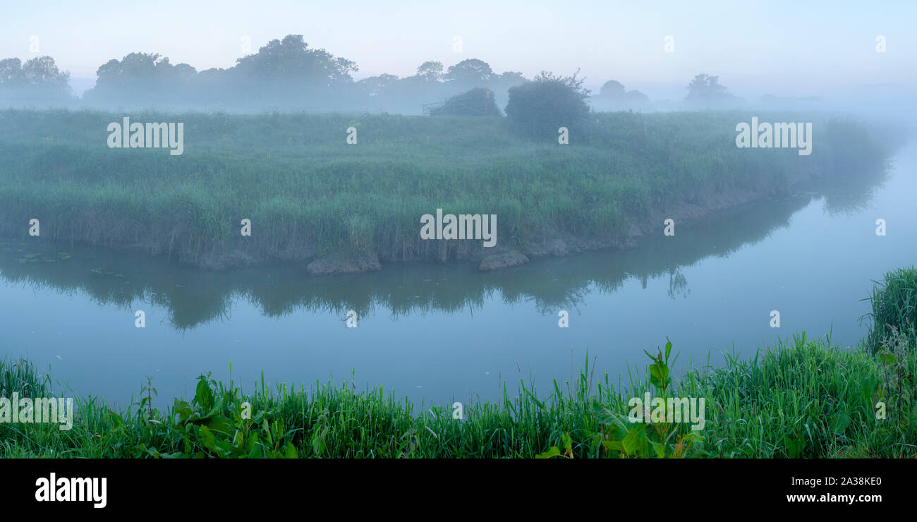A misty morning on the banks of the River Adur near Partridge Green, West Sussex, England Stock Photo