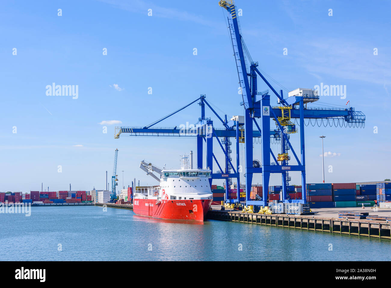 Cranes for removing ISO shipping containers from freight ships at the Port of Rotterdam, Netherlands. Stock Photo
