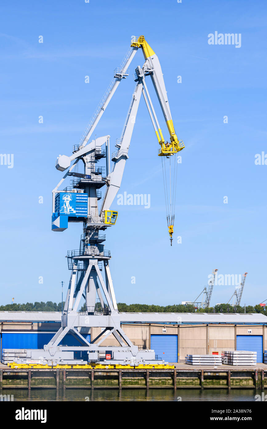 Cranes for removing cargo from freight ships at the Port of Rotterdam, Netherlands. Stock Photo