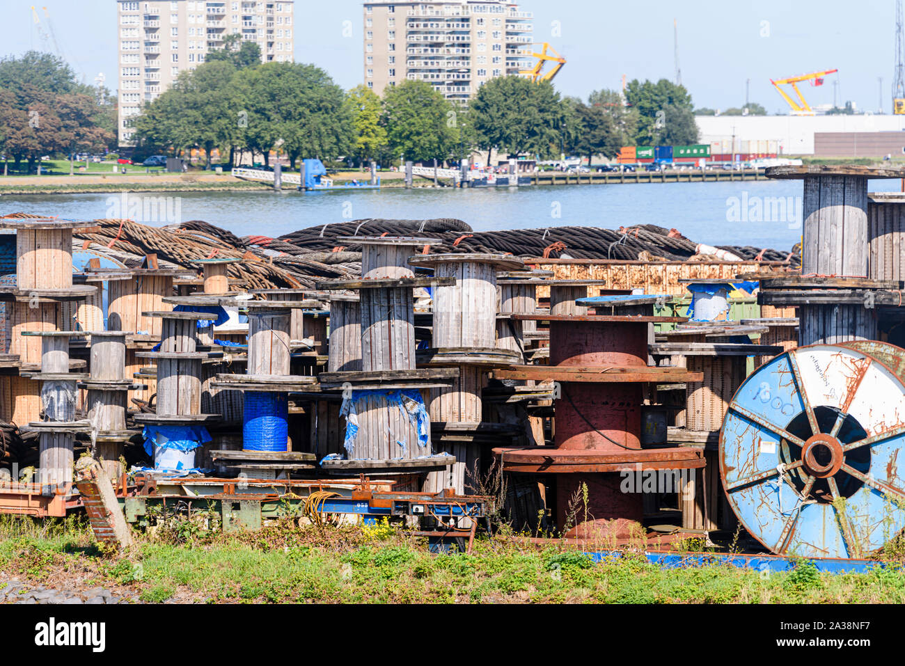 Empty wooden spools, used for transporting large electricity and telecommunications cables, lie at Rotterdam Harbour, Rotterdam, Netherlands Stock Photo