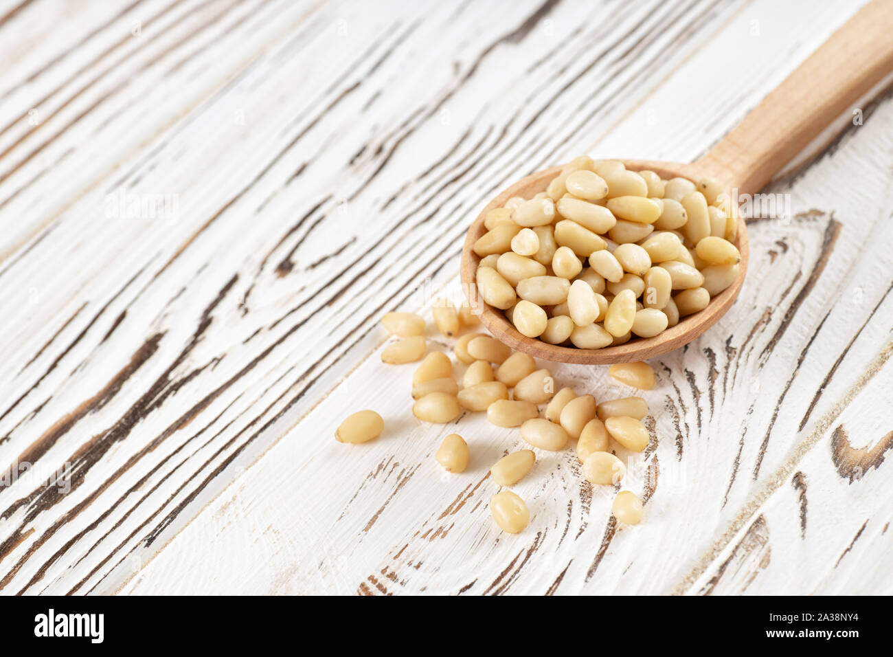 cedar nuts in spoon Stock Photo
