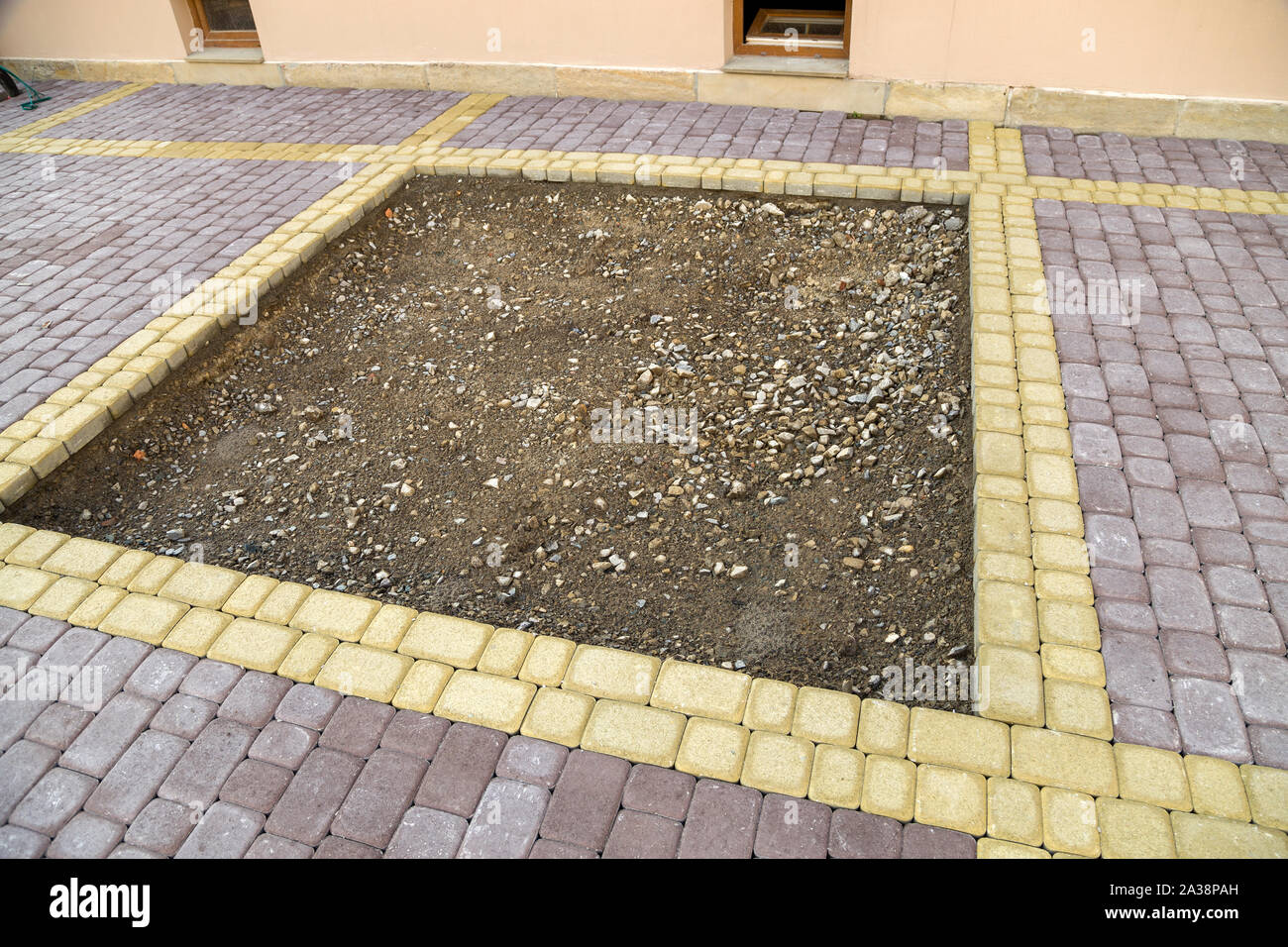 Installation of stone paving slabs in a yard Stock Photo Alamy