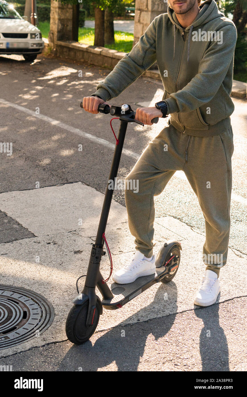 Man on a push scooter hi-res stock photography and images - Alamy