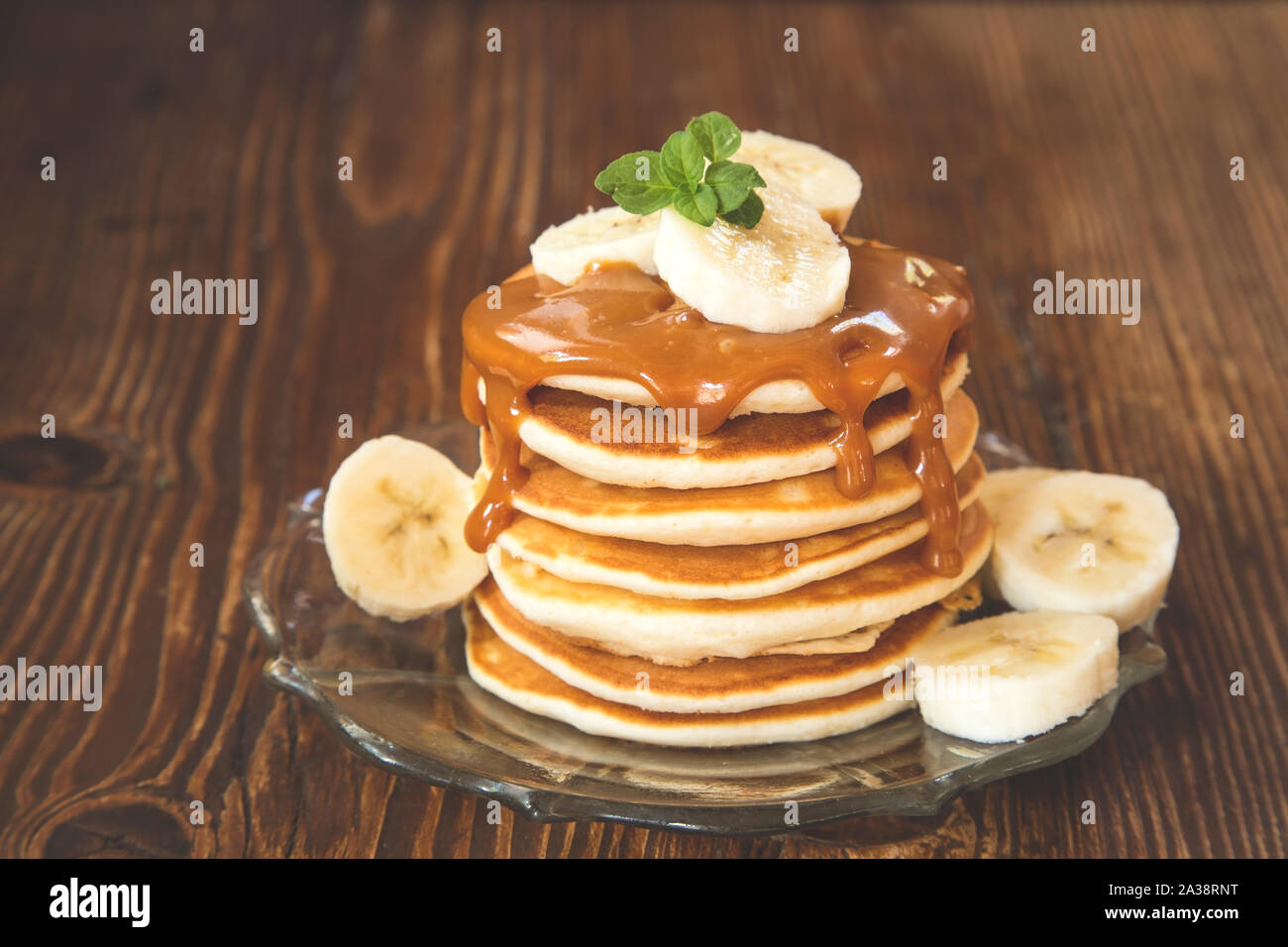Pancakes with caramel sauce and banana Stock Photo Alamy