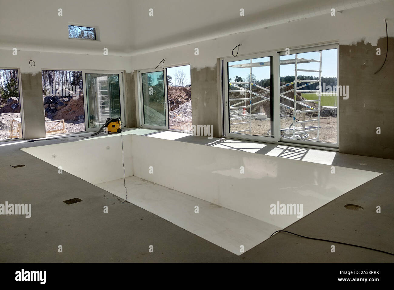 Interior of a house with big swimming pool under renovation works Stock ...