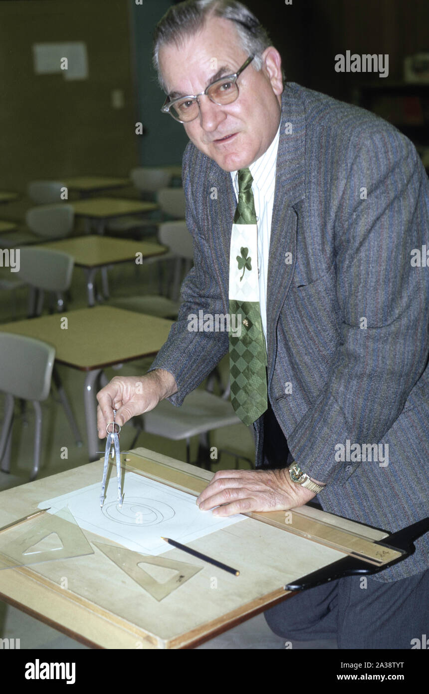 1957 Math Teacher in Elementary School Works on aClass Assignment in the Classroom, USA Stock Photo
