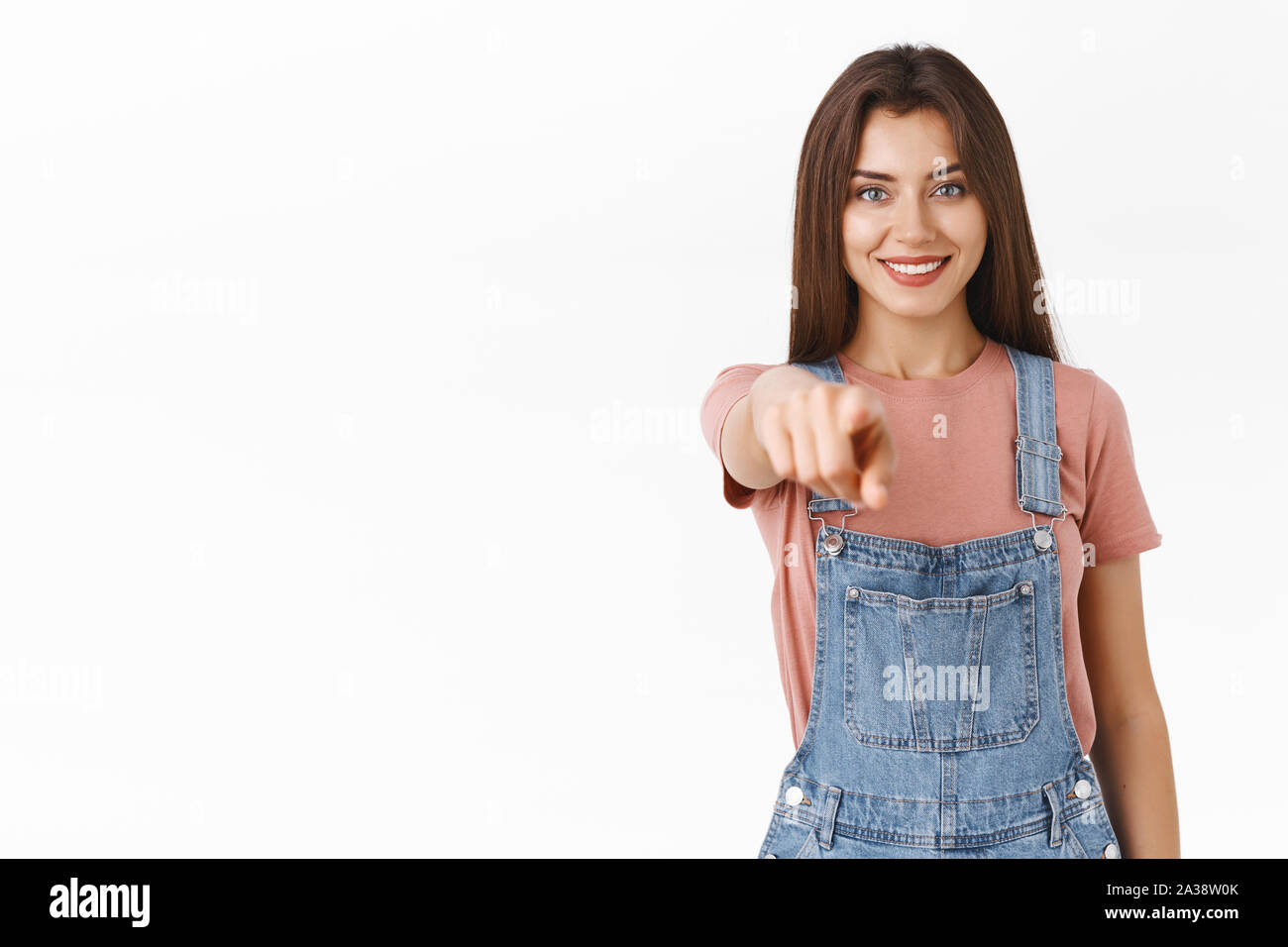 Girl pointing at you as making choice, gather team. Attractive confident and motivated cute female indicating camera with satisfied, self-assured Stock Photo