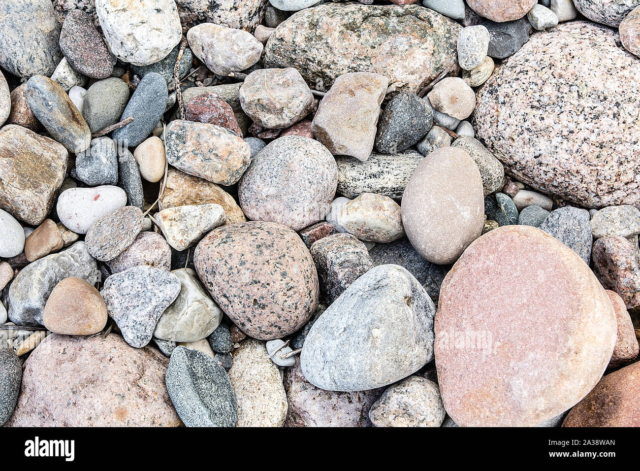 Many colorful stones on the beach background Stock Photo