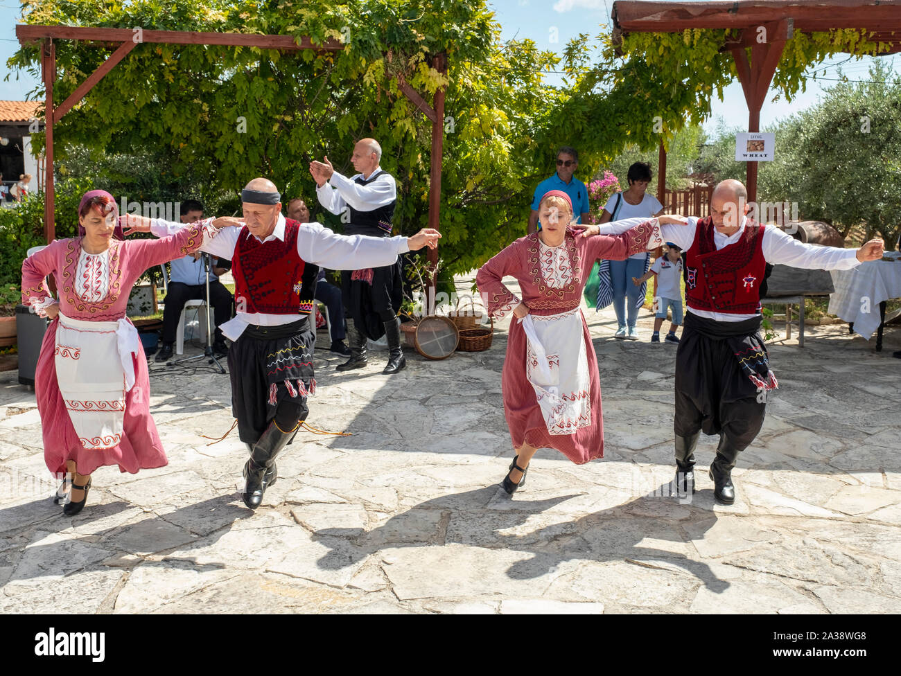 Cypriot dancers performing in traditional costumes at the Oleastro