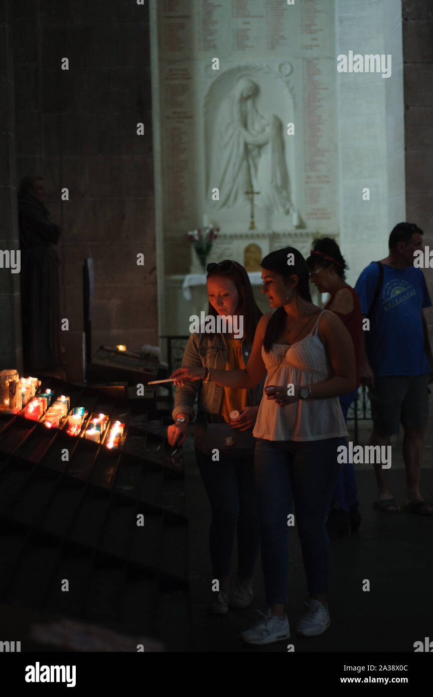 Devotional candles being lit in church Stock Photo - Alamy