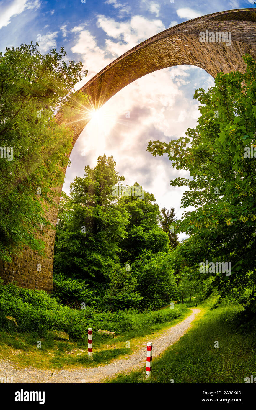 Old railway arch bridge in Germany Stock Photo