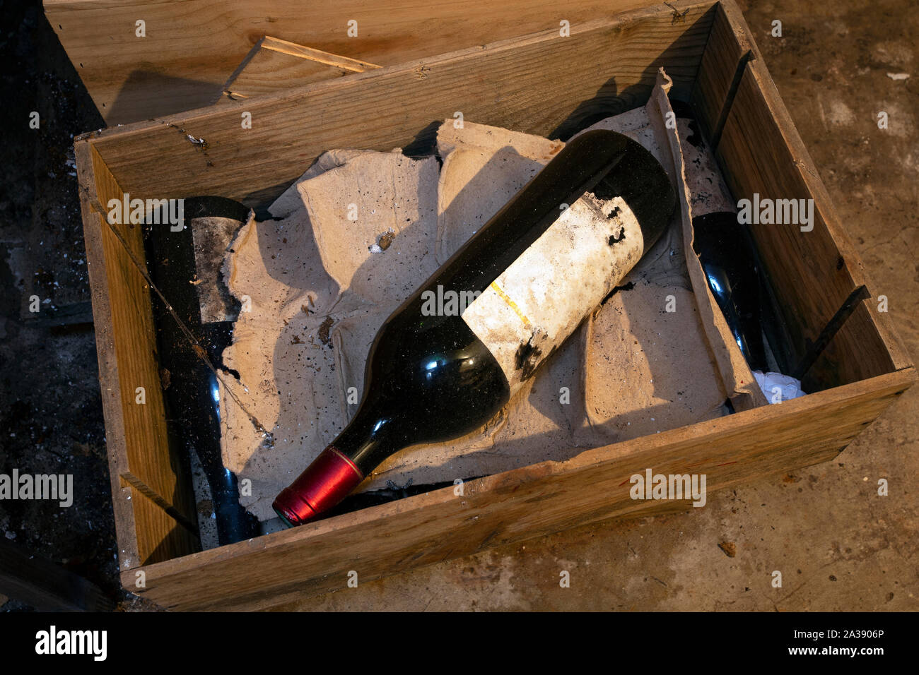 old dusty wine bottle in a box in the cellar Stock Photo Alamy