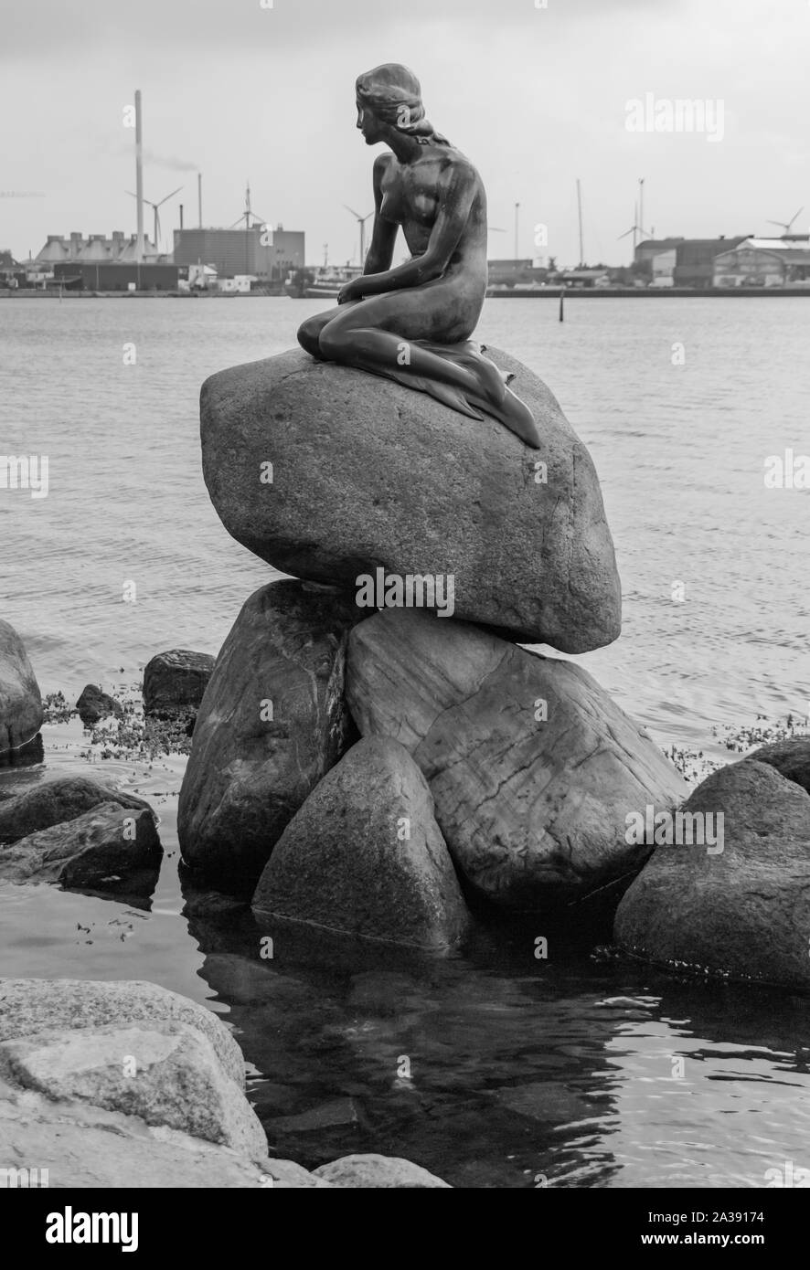 A black and white picture of the Den Lille Havfrue statue, in Copenhagen. Stock Photo