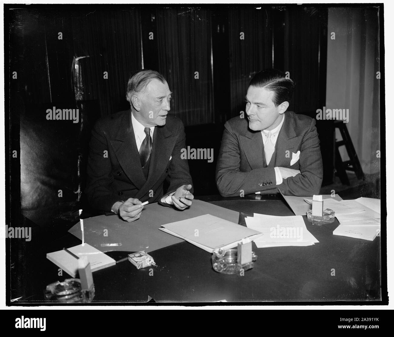 Sage advice. Washington, D.C., Feb. 2. Senator Key Pittman, Veteran from Nevada and Chairman of the Senate Foreign Relations Committee, discusses with the youthful Republican Senator Henry Cabot Lodge, of Massachusetts, the amendment he (lodge) has proposed to the Neutrality Act which would make the U.S. Neutral in fact as well in theory. Senator Lodge is also a member of the Senate Foreign Relations Committee, 2/2/38 Stock Photo