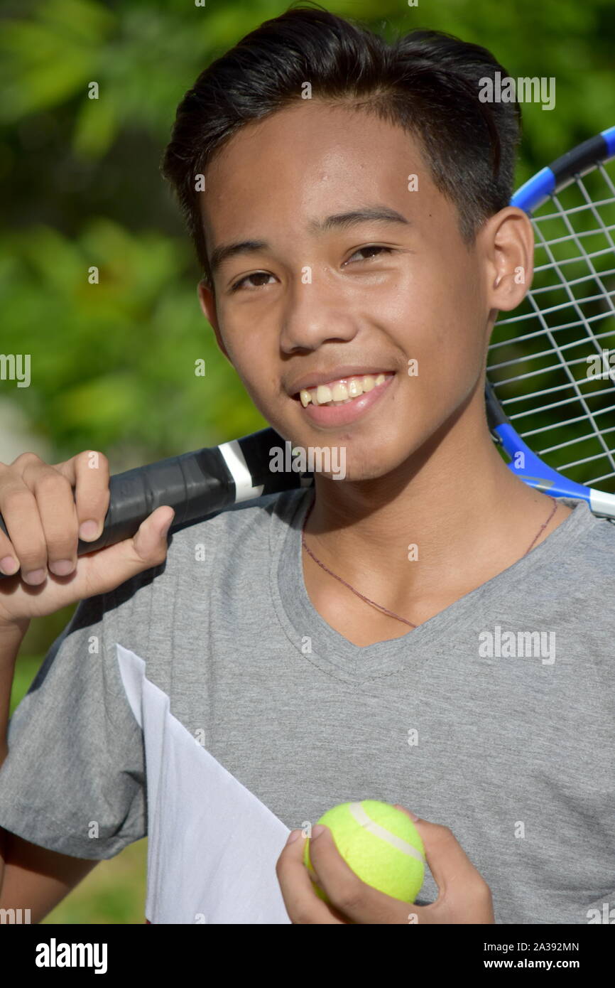 Smiling Fit Male Tennis Player With Tennis Racket Stock Photo - Alamy