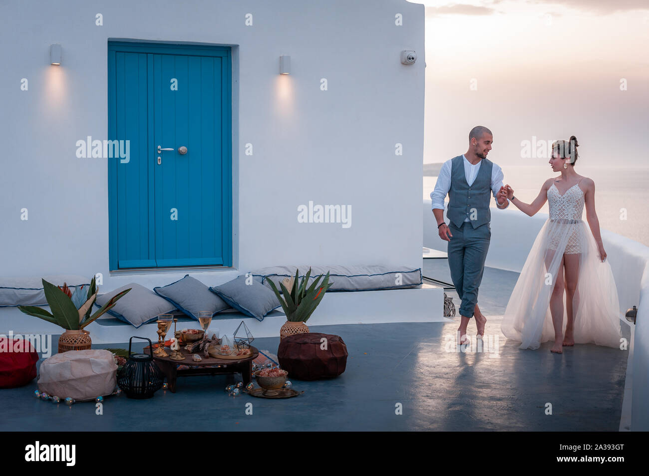 beautiful bride and groom in their summer wedding day on greek island Santorini Stock Photo