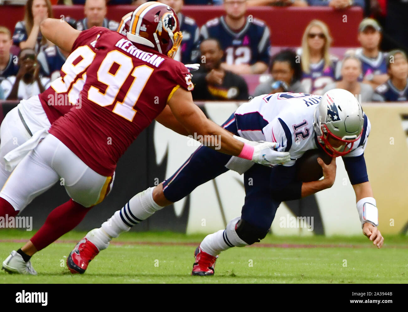 Washington Redskins linebacker Ryan Kerrigan (91) scores a touchdown  against the Atlanta Falcons in the first quarter at FedEx Field in  Landover, Maryland on Sunday, October 7, 2012. Redskin defenders DeAngelo  Hall (