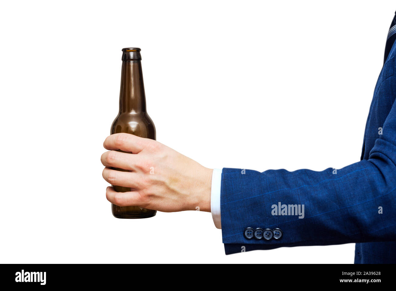 A man hand holding beer bottle on white background. A hand holding up a beer bottle without label. Stock Photo