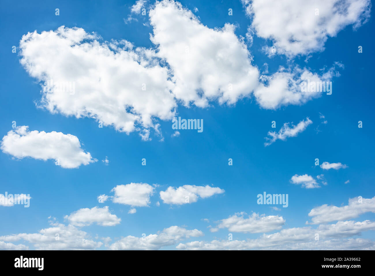 Blue sky with fluffy clouds as a background Stock Photo