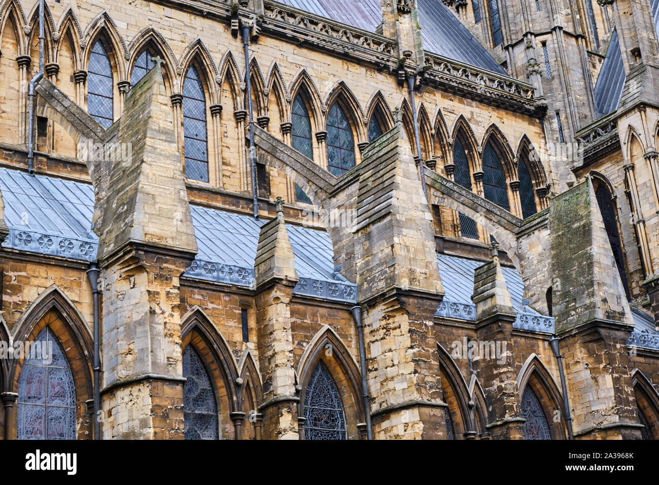Flying buttresses supporting the south side of Lincoln Cathedral in Lincolnshire, England Stock Photo