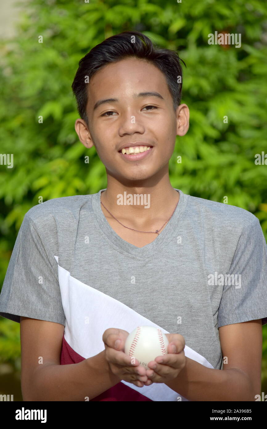 Happy Male Athlete Boy Baseball Player With Baseball Stock Photo