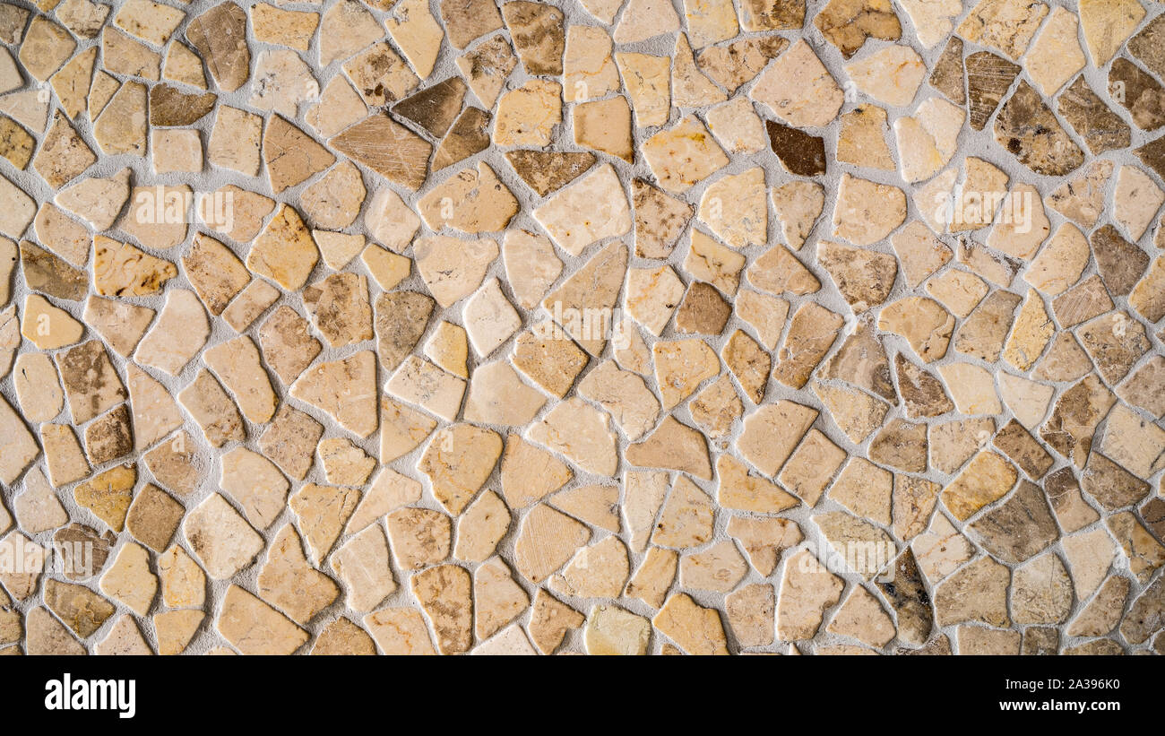 Texture or background of a wall made of uneven stones Stock Photo