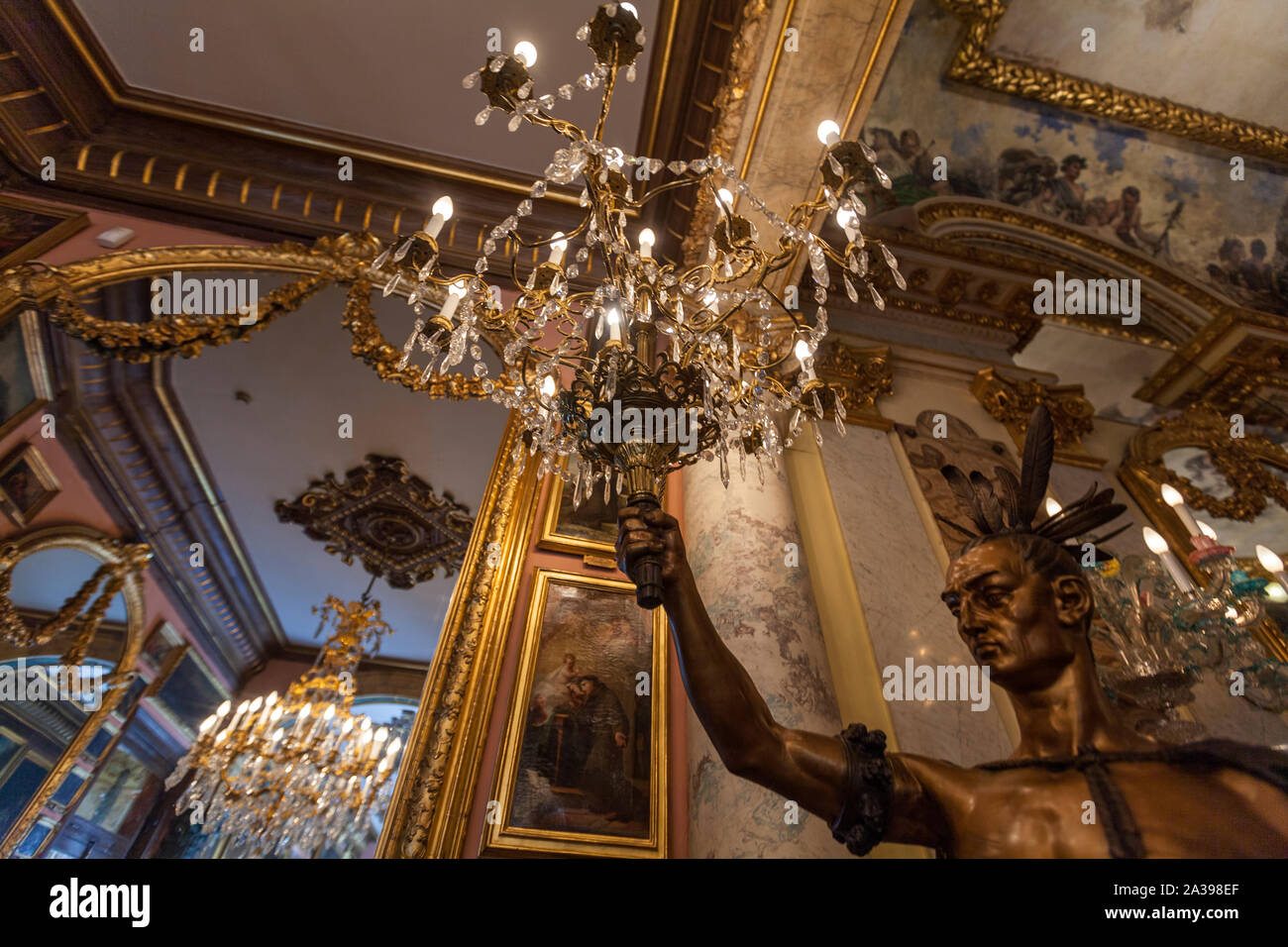 Sculpture of a man hanging a lamp in Museo Cerralbo, Madrid, Spain Stock Photo