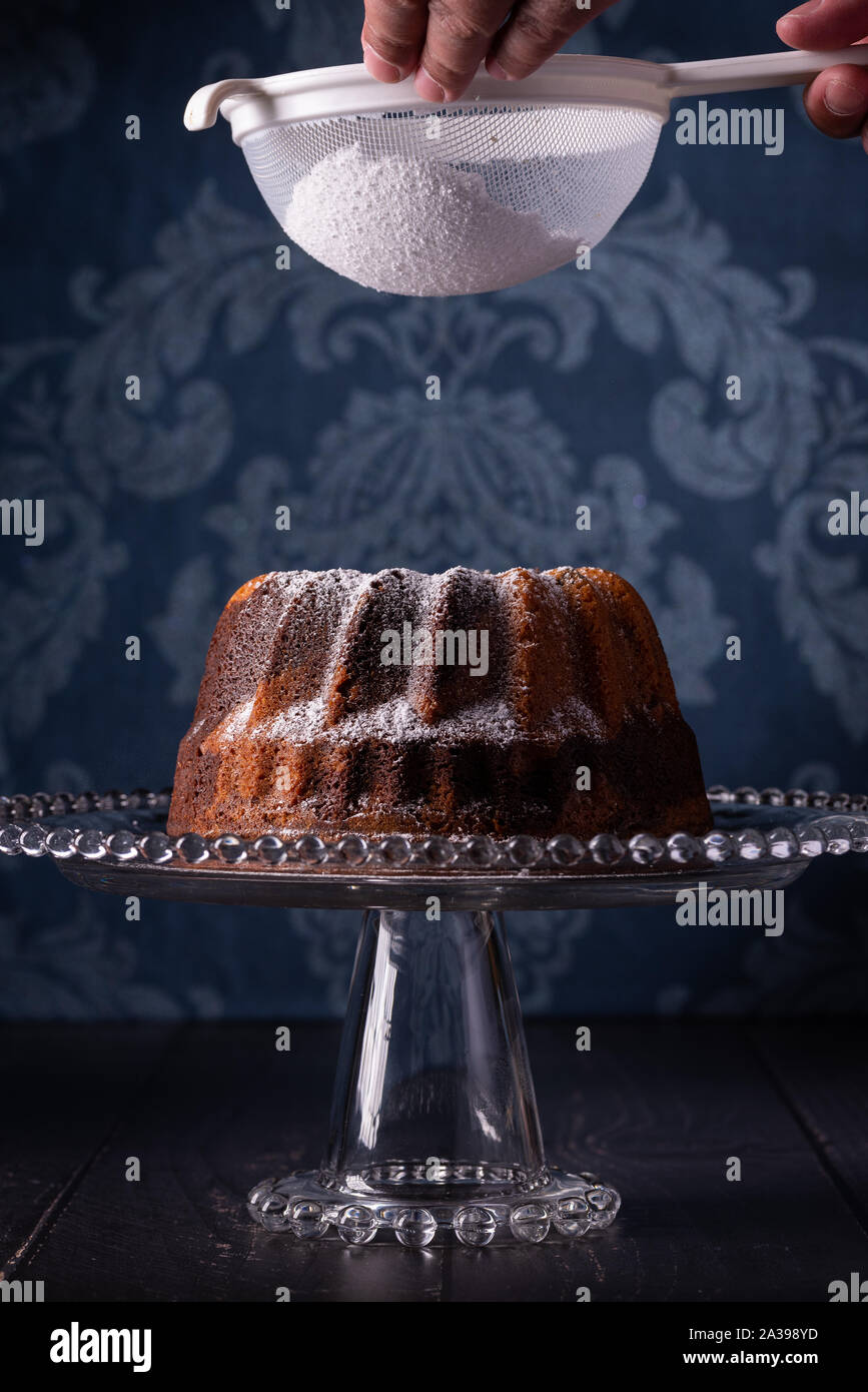 Marbled Bunt Cake, Red Wine with Dark Blue Damask Background Stock Photo